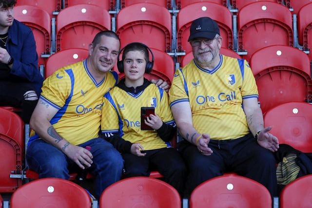 Mansfield Town fans watch the 2-2 draw at Doncaster.