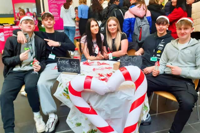 Students were on hand to get visitors to send a friend a candy cane