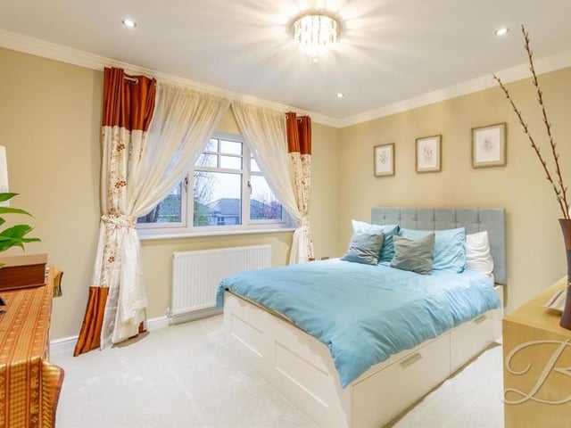 Sweet dreams are very likely in this classy second double bedroom. It has a carpeted floor, downlights and views of the back garden.