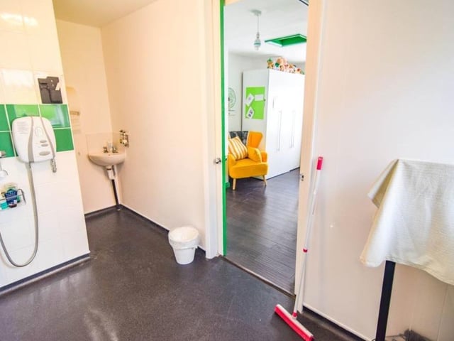The first ground-floor bedroom at the Mansfield house also has its own spacious en suite, with walk-in shower.