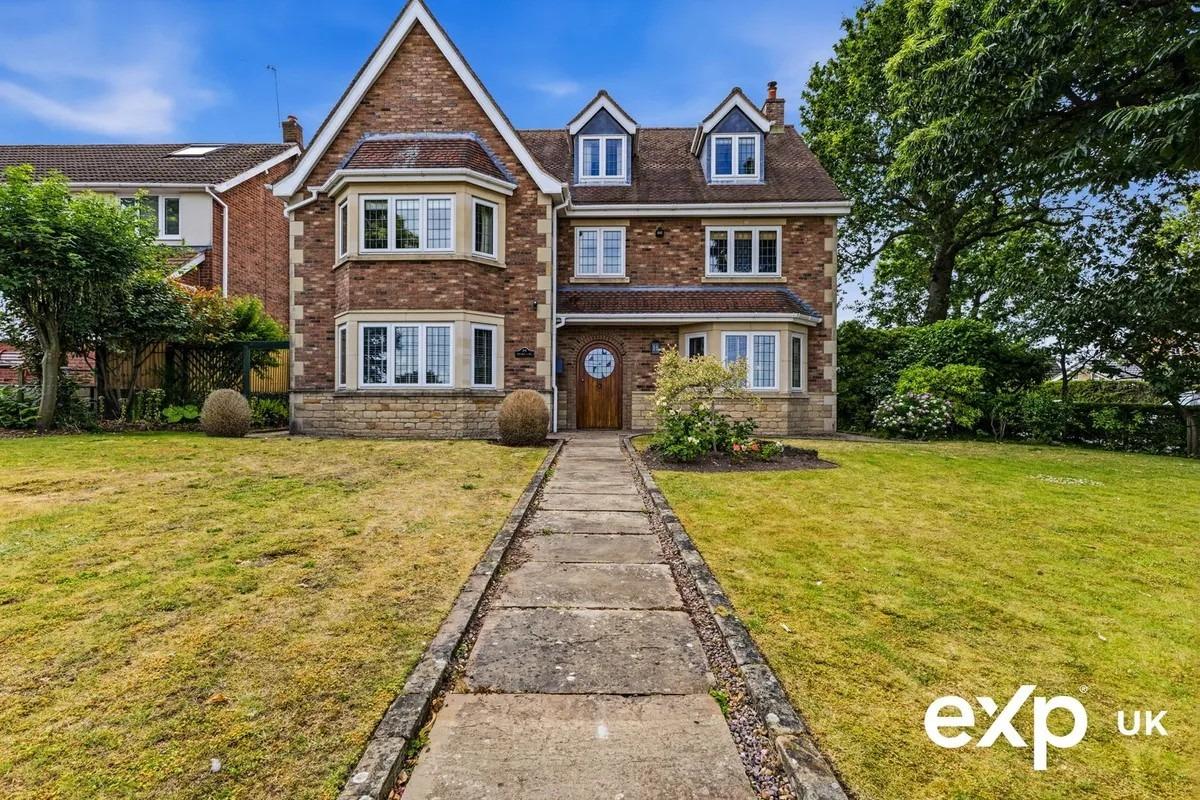 This incredibly attractive, three-storey, detached family home stands elevated with an imposing presence and a notable façade