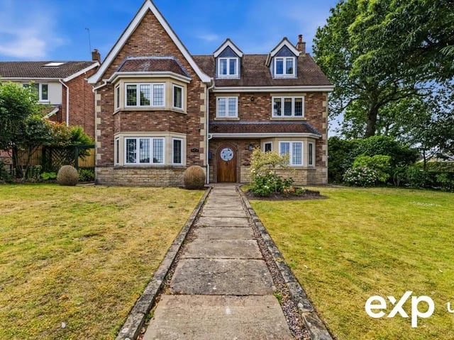 This incredibly attractive, three-storey, detached family home stands elevated with an imposing presence and a notable façade