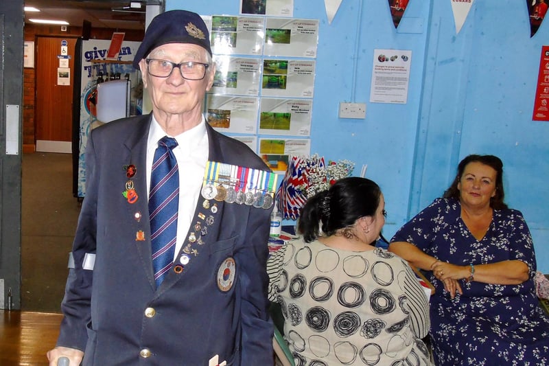 A proud veteran displaying his medals.