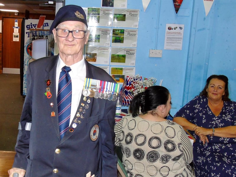 A proud veteran displaying his medals.