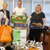 Mansfield Ambulance technician Loretta Leeming and her husband Phil handing over an enormous amount of food she has collected to Linda Gannon and Adele Hopkinson of the Brunts Charity