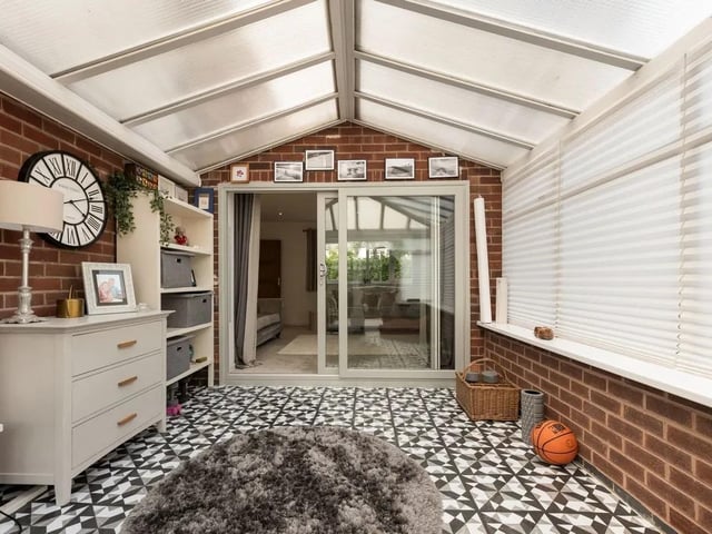 A sunny conservatory to the rear enjoys captivating views down the garden through the uPVC windows to the rear, along with uPVC French doors opening onto the patio.