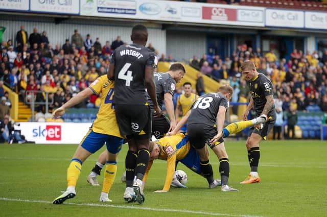 Mansfield Town goalscorer George Maris in the thick of the action during Saturday's win over against Stockport County FC. Photo by Chris & Jeanette Holloway/The Bigger Picture.media.