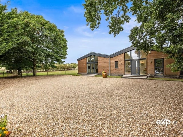 The epitome of luxury countryside living, this remarkable detached barn conversion boasts epic proportions and vast spaces. A versatile, interconnected layout and a one-level lifestyle offer an amazing arrangement of multiple reception rooms, along with a spectacular modern kitchen diner, a practical utility room and cloakroom, and four double bedrooms, all with bathroom or shower facilities. Serene gardens, far-reaching views, a driveway with ample parking, and the convenience of village amenities close by ensure that every box is ticked.