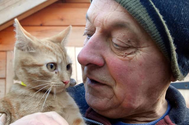 Philip Clarke with Morris at the Kirkby Cats Home, 2009.