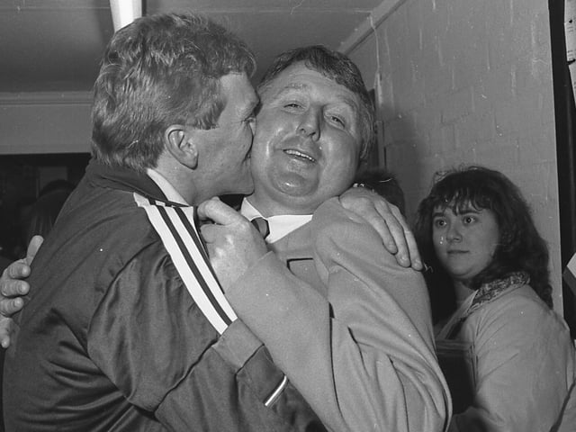 George Foster plants a kiss on Stags' sponsor Alan Bostock of Gunthorpe Textiles' cheek after clinching promotion.