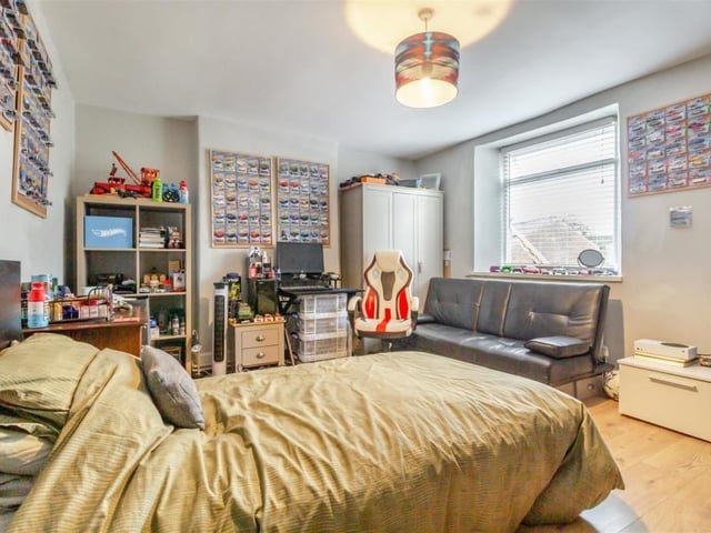 Another spacious bedroom at the £585,000 renovated post office. As with four of the five bedrooms, the floor is laminated.
