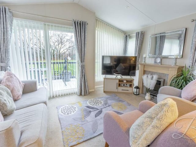The living room features sliding doors that lead on to the £130,000 property's balcony.