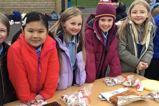 Year four students Teya, Abbie, Charlotte, Pippa and Bella at their bake sale in aid of the air ambulance.