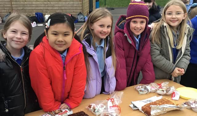 Year four students Teya, Abbie, Charlotte, Pippa and Bella at their bake sale in aid of the air ambulance.