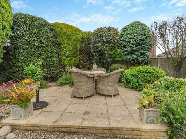 Here is the second patio at the bottom of the rear garden. Private and enclosed, it has space for a relaxed seating area.