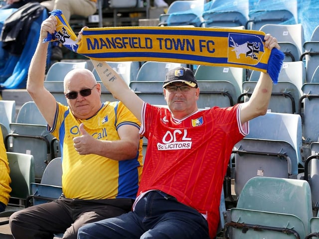 Mansfield Town fans watch the 1-1 draw at Gillingham.