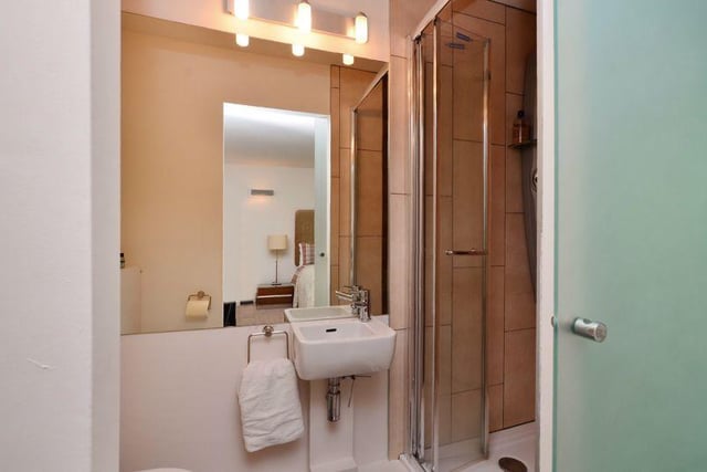 This modern en-suite has a shower.