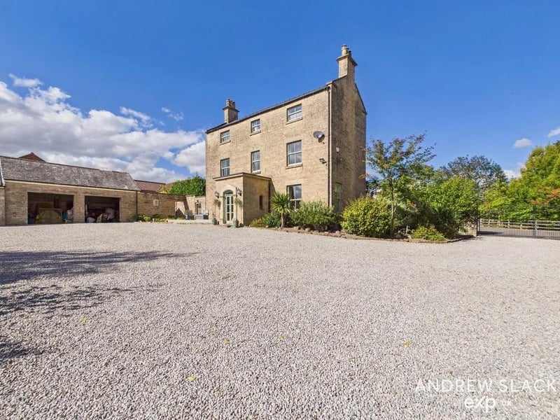 The gardens are equally impressive, with mature lawns, patios for entertaining, and a variety of outbuildings.