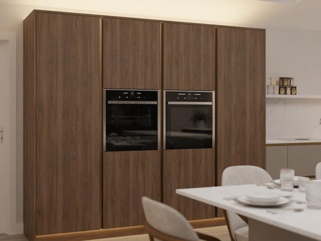 Integrated appliances aplenty adorn the dining kitchen