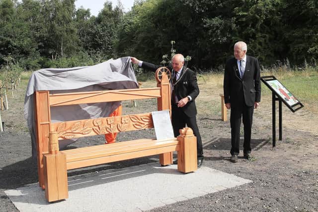 Coun Robert Bullock, Mayor of Broxtowe, unveils the new memorial bench with council leader Coun Milan Radulovic. Photo: Submitted