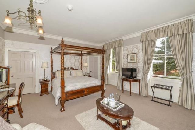 One of the stunning bedrooms, complete with four-poster bed.