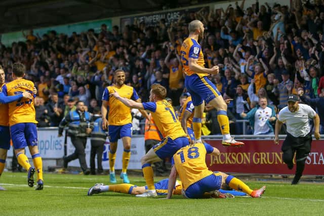 The team celebrate their first half goal at Northampton Town. Photo by Chris Holloway / The Bigger Picture.media