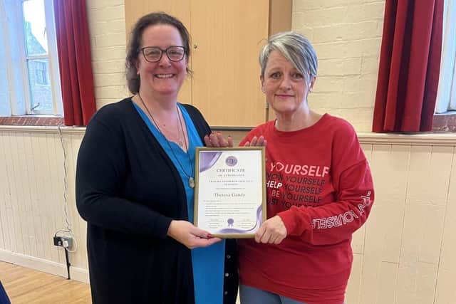 Theresa Gandy (R) receives her Certificate from S.H.E UK Project Manager, Tina Sharpe (L)
