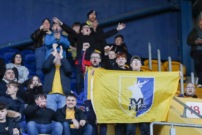 Mansfield Town beat Accrington 2-1 to seal a long-awaited promotion.
