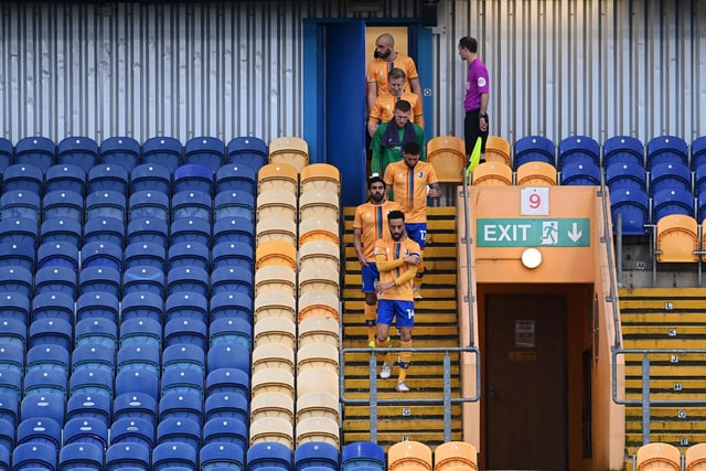 James Perch leads his team out for the Sky Bet League Two match between Mansfield Town and Forest Green Rovers on March 23, 2021. Sporting stadiums around the UK remained under strict restrictions with no fans allowed inside.