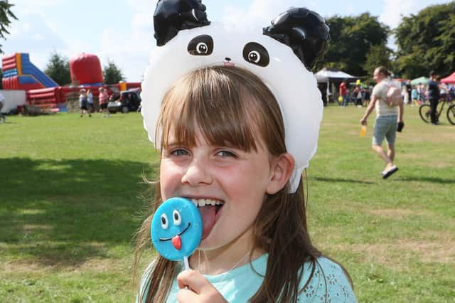 Libby Wright enjoys a lollipop at the event.