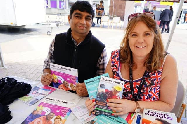 Inspire community learning, Marlon Imamshah and Sarah Ball on a stall back in June 2022.