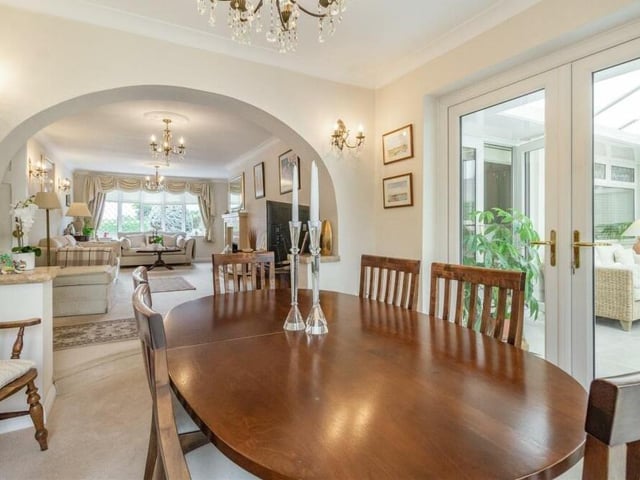 This photo shows a view from the dining table, with the lounge ahead and the conservatory to the right.