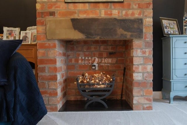 Here is a close-up of the exposed-brick feature fireplace in the second lounge. Get your slippers on and snuggle up!