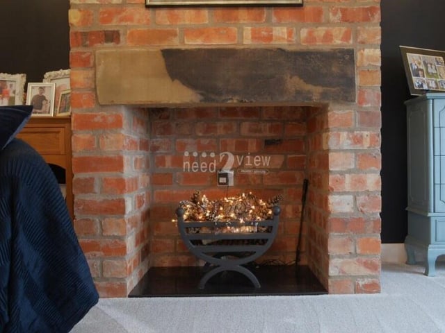 Here is a close-up of the exposed-brick feature fireplace in the second lounge. Get your slippers on and snuggle up!