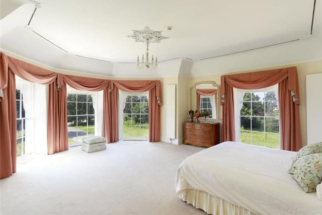 There are eight bedrooms at Hunton Court, including this luxurious beauty, with its multiple views of beautiful and established 18th century parkland that spans 132 acres.