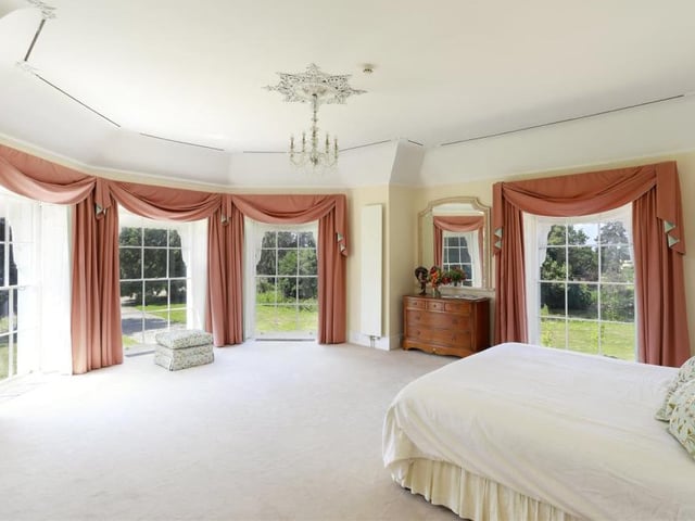 There are eight bedrooms at Hunton Court, including this luxurious beauty, with its multiple views of beautiful and established 18th century parkland that spans 132 acres.