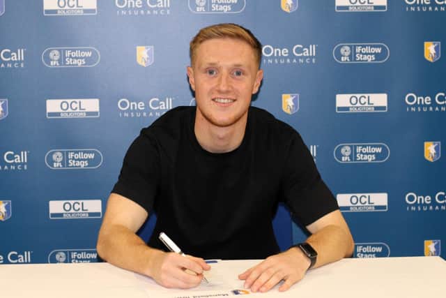 Davis Keillor-Dunn signs for the Stags.