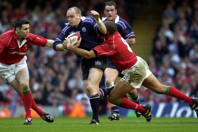Current Scotland coach Gregor Townsend is tackled by Colin Jarvis of Wales. Townsend, who was playing in France for Castres at the time, was at stand-off for Scotland in Cardiff.