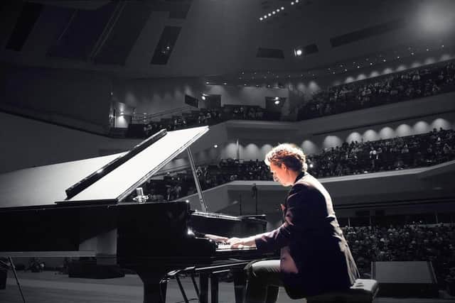 Chris Miggells playing piano