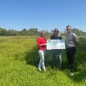 The cheque being handed over