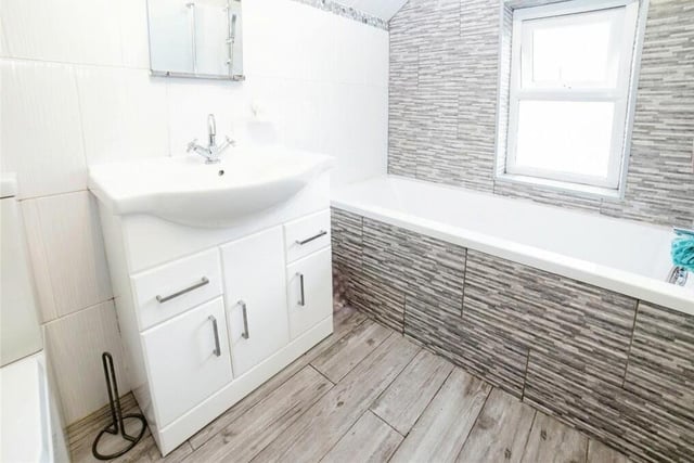 Before we go up to the attic, let's take a quick look at the fitted family bathroom on the first floor.