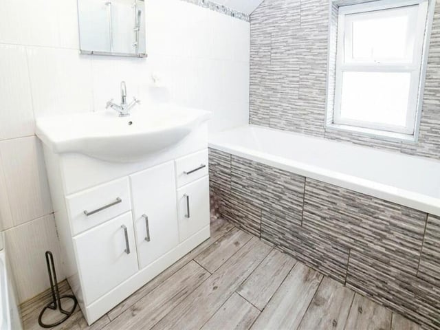 Before we go up to the attic, let's take a quick look at the fitted family bathroom on the first floor.
