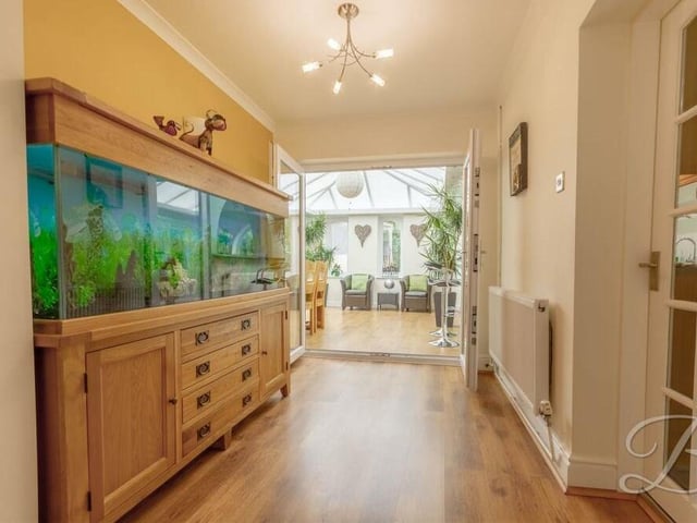 This section of the ground floor links the lounge to the dining room and the orangery. On the right is a door to the kitchen.