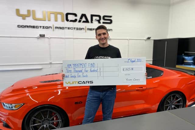Nick Briton from YumCars with the £3,425 cheque