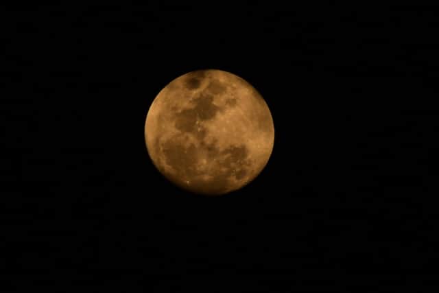 A "true" blue moon is set to appear tonight. Photo by Norberto Duarte/AFP via Getty Images.