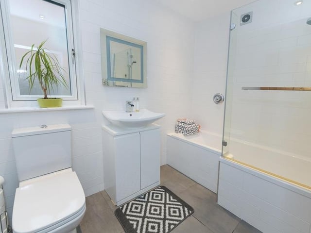 Bath, shower, wash hand basin and low-level WC can all be found in this bathroom.