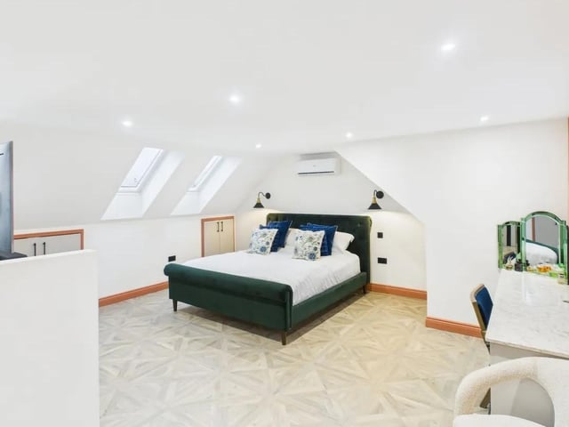 The second floor is devoted to a luxurious master suite, complete with a contemporary en suite bathroom.