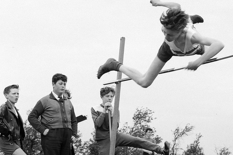 This most likely wouldn't be allowed these days. This pupil looks all set for a heavy fall after going over the bar in the high jump at Dukeries School in 1963