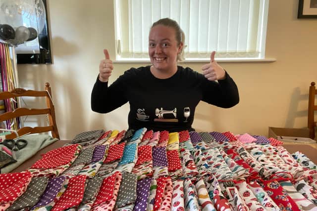 Elizabeth Orridge with her home-made wash-bags for key workers' uniforms.