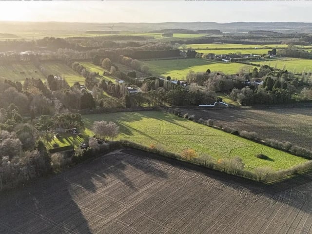 The property is set in extensive grounds with established gardens and paddocks and stunning open countryside views